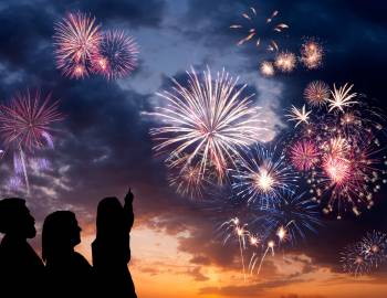 A family watching the fireworks display at HarbourFest